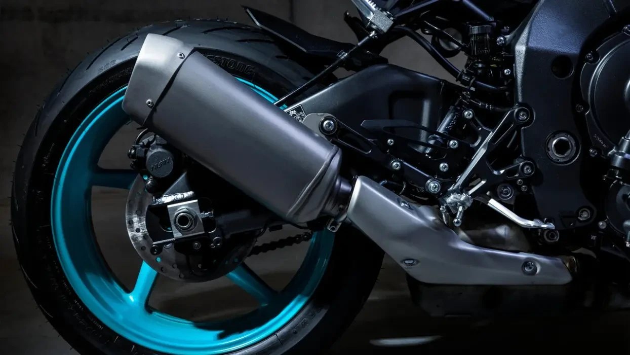 Detail image of Yamaha MT-10 in Cyan colourway, exhaust and rear tyre