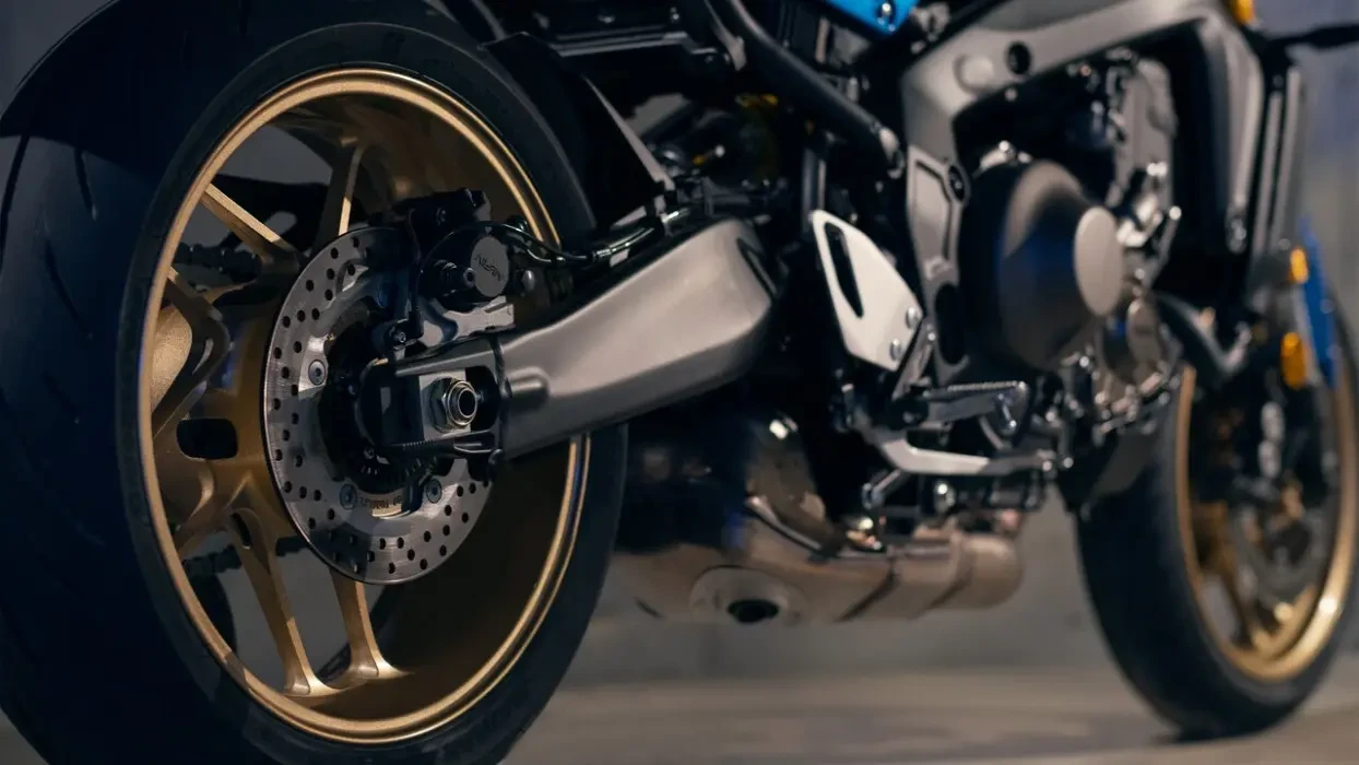 Detail image of Yamaha XSR900 in Blue colourway, lower rear section, rear wheel, suspension, engine, front wheel