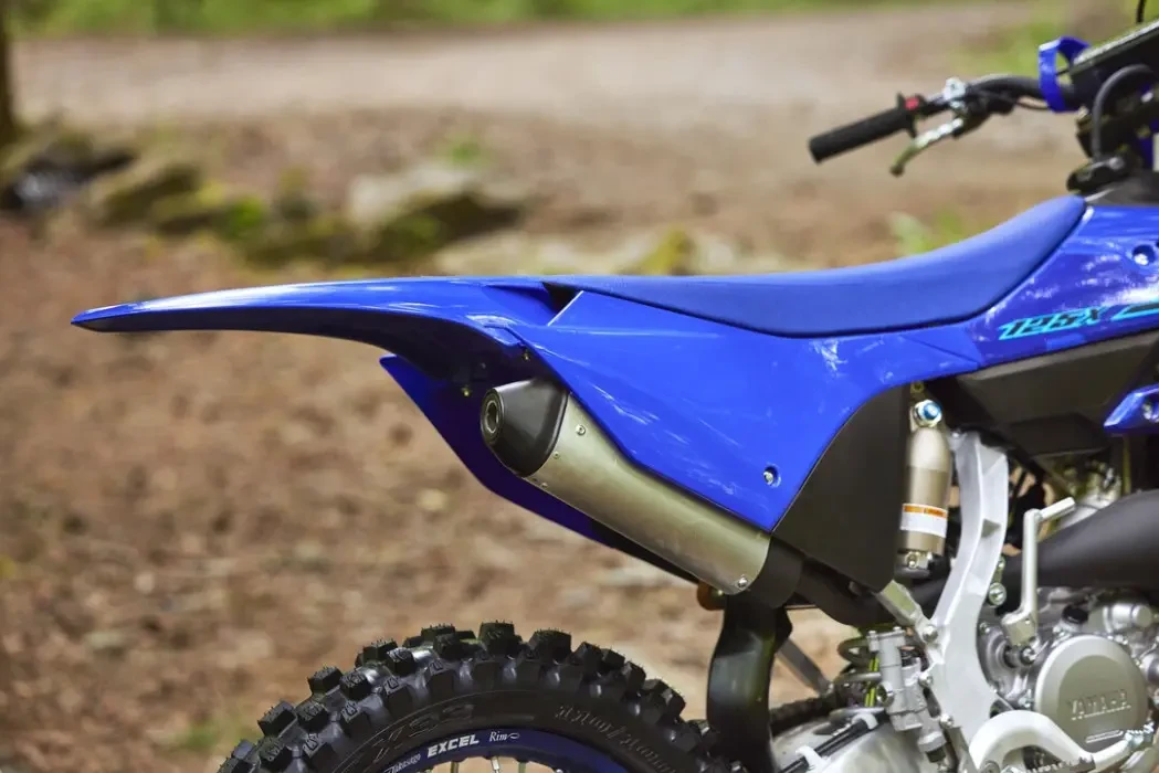 Detail image of Yamaha YZ125X two stroke in blue colourway, rear mudguard and exhaust