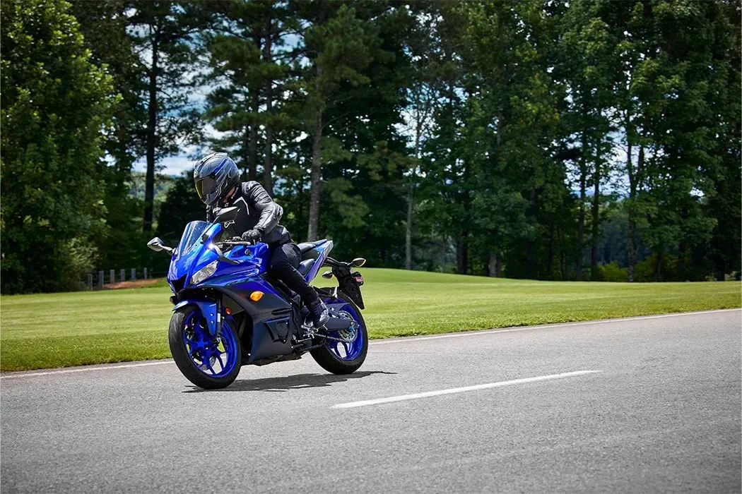 Action image of Yamaha YZF-R3 LAMS in blue colourway, front three quarter right long shot