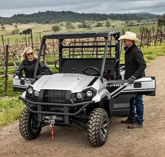 Outdoor image of Kawasaki Mule Pro MX-SE, with two farmers working on vineyard