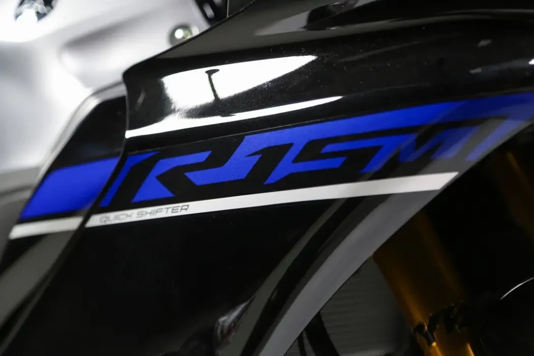 Detail image of Yamaha YZF-R15M in Icon Performance Colourway, side fairing with R15M badge