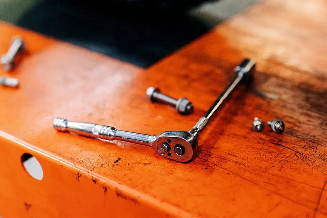 Ratchet with socket attached sitting on top of a tool box at Brisan Motorcycles Newcastle