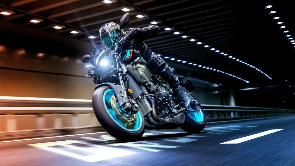 Action image of Yamaha MT-10 in Cyan colourway, front three quarter right hand turn