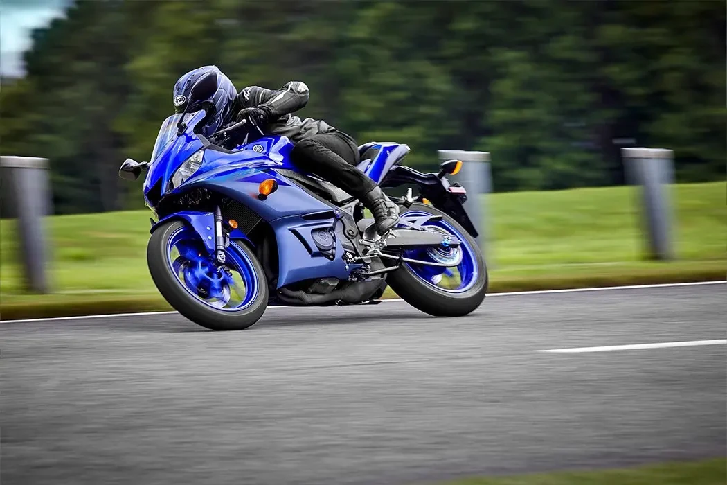 Action image of Yamaha YZF-R3 LAMS in blue colourway, navigating right hand turn