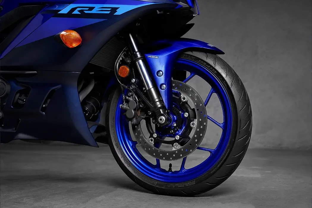 Static Detail image of Yamaha YZF-R3 LAMS in blue colourway, front wheel and brakes