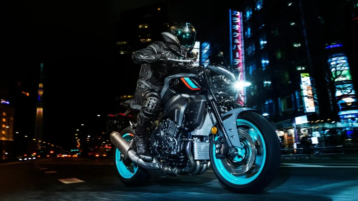 Action image of Yamaha MT-10 in Cyan colourway, front three quarter tracking