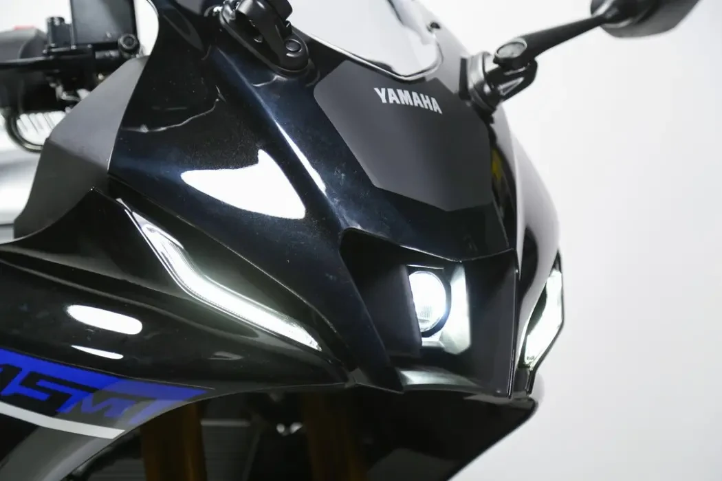 Detail image of Yamaha YZF-R15M in Icon Performance Colourway, front headlight